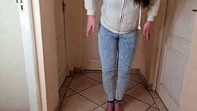 Young amateur's homemade pee fetish video in jeans and fleece jacket