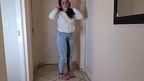 Young amateur's homemade pee fetish video in jeans and fleece jacket