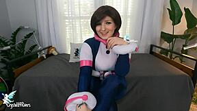 Big breasted teen gives a handjob with a femdom attitude and a cosplay costume