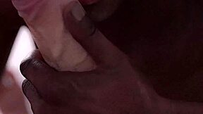 A black man gives a gay blowjob to a white man with a large penis