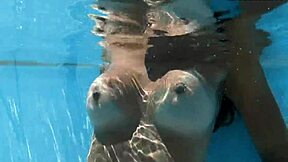 Angelica, the best MILF ever, swims naked in the pool
