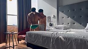Gay hotel room action with university boy and big cock