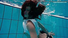 A sexually aroused teenage girl strips quickly and reveals her beautiful body