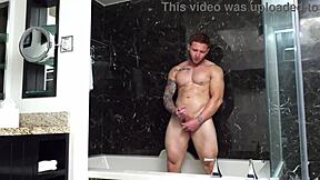Muscular hunk takes it up the ass while giving a blow job and rim job in the shower