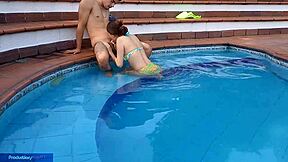 Young Latina girl enjoys pool time with her stepbrother