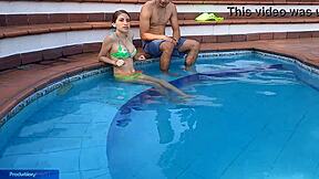 Young Latina girl enjoys pool time with her stepbrother