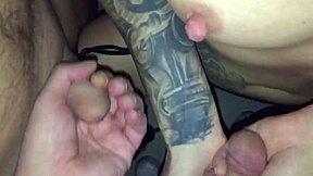 A goth woman with tattoos meets a stranger in a video booth and gives him a blow job