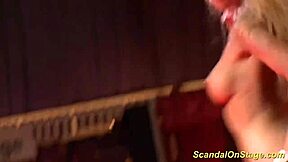 What's up with this busty milf stripping on stage?