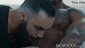 Muscular black gay man has rough sex with bearded white hunk