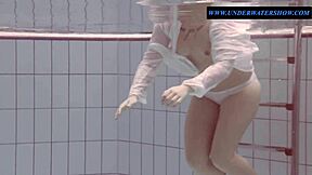Tattooed teen Sara in a bikini, solo play in the pool