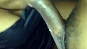 A black girl gives a good blow job to a big black cock