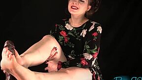 Hey, check out this milf in high heels and pantyhose stripping for a barefoot footjob. She’s got skills!