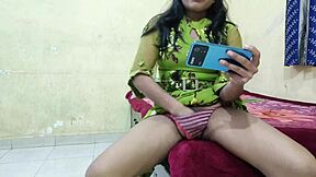 Young Indian girl secretly watches sexy videos on her phone