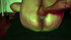 A mature and curvaceous woman with a tan gets a pleasurable stimulation of her big clitoris