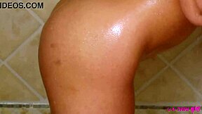 Young and petite brunette enjoys a hot shower and gets into some hot water