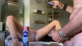A homemade video of a horny couple having sex in the kitchen