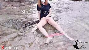 A beautiful Asian woman is filmed while being bent over and having sex in a group outdoor scene