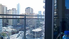 Beautiful gamer girl exposes her body on the balcony