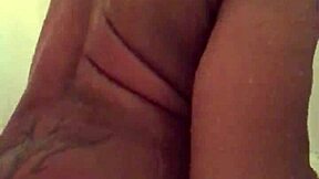 Steamy shower scene with solo play and dildo action