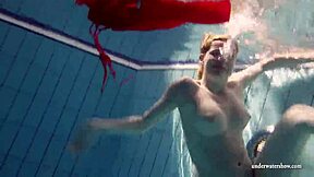 Lucie, Russian teen, goes for a swim in the pool