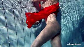 Lucie, Russian teen, goes for a swim in the pool
