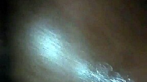 Giving a black MILF a massage with oil and some extra pleasure