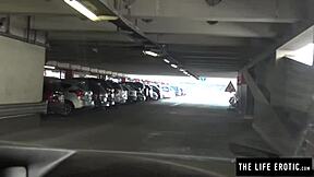 A beautiful woman pleases herself in a public garage and exposes her natural beauty