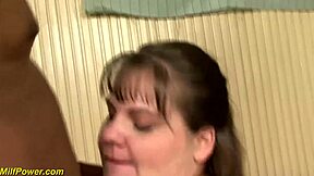 A mature woman with large breasts gets her first big black cock