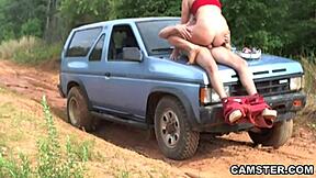 An amateur couple has sex outdoors while waiting for a tow truck