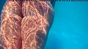 Solo pleasure in the pool in public