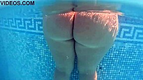 Solo pleasure in the pool in public