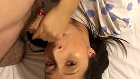 Close up of Lily Fox's face as she gives Tommy Knoxx a blow job