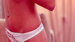 Young woman with small breasts and naked body pleases herself with a dildo