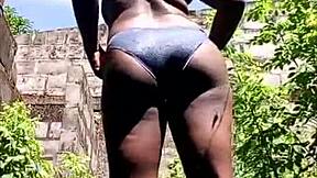 African American girl’s round ass exposed outside