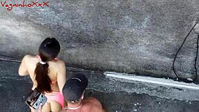 Muscular bodybuilder Pamela Pantera and Vagninho in outdoor action