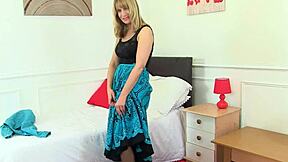 Sapphire Louise, a mature blonde, enjoys pleasure from her wet pussy