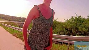 A sexy girl enjoys a fingering and toy session with her partner outdoors
