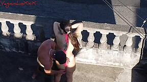 Muscular bodybuilder Pamela Pantera and Vagninho in outdoor action