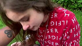 Beautiful brunette with blue eyes sucks big black cock in the park
