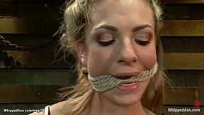 Red-haired mistress with anal sex with a blonde submissive who is tied up