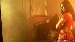 Pretty Asian dancer performs erotic belly dance