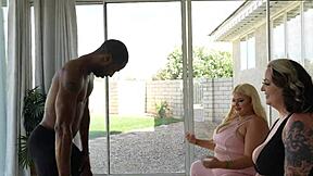 Two blonde BBWs give a blowjob to a BBC personal trainer in this video
