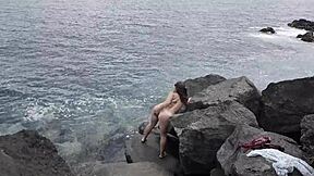 Wow, unexpected cumshot hits nudist girlfriend's face on public beach!