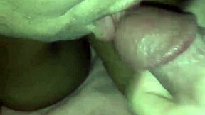 An elderly black woman drinks the cum from her lover’s penis