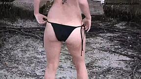 Skinny blonde teen shows off in public beach striptease