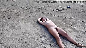 A beautiful woman with an amazing set of large natural breasts and a perfect ass enjoys rough sex with a stranger at a nudist beach