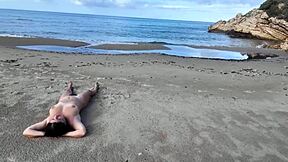 A beautiful woman with an amazing set of large natural breasts and a perfect ass enjoys rough sex with a stranger at a nudist beach