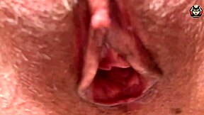 There is a close up of a hairy milf’s pussy while she has an orgasm