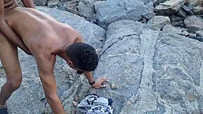 African and gay men enjoy anal sex on the beach