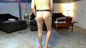 A nude gay man has sex while doing household chores
